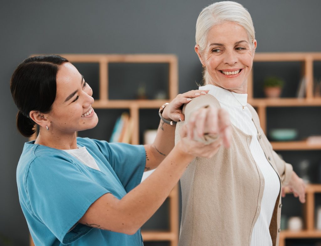 Healthcare professional supporting a senior woman during a wellness visit